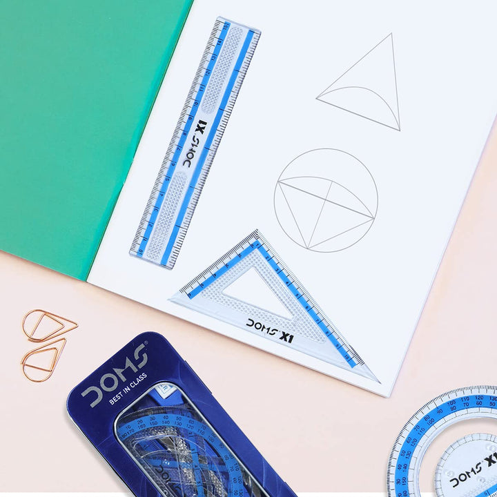 DOMS X1 Premium Mathematical Drawing Instrument Box WIth Ruler, Protector And Set Square kept on Paper.